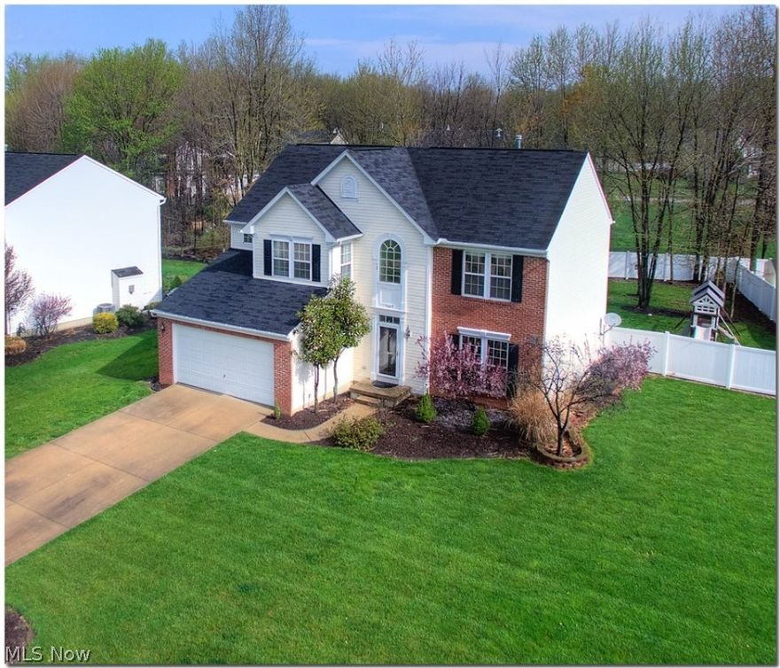 Truly a REMARKABLE HOME that includes all the extras will delight you from the partial brick exterior to the light fill spacious room while being situated on a very large lot that includes a premium, Vinyl fenced yard along with patio/playset! Easy to show & fast occupancy is available. Enter to soaring ceiling & a premium floored foyer that includes upgraded spindled staircase. Enter the gorgeous white kitchen (All appliances included) w/large pantry that is open to the family room & includes the much sought after vaulted MORNING ROOM that includes walls of glass for a bright & cheery feel...Family room includes all the extra windows & custom floor to ceiling stone fireplace that can be viewed from all the rooms. Formal dining for Holiday Gatherings! 1st floor laundry. Owner's suite is amazing w/volume ceilings, desirable sitting area, oversized walk in closet along w/glamour bath that has been completely remodeled w/attractive tile, granite tops & more. All additional bedrooms are la