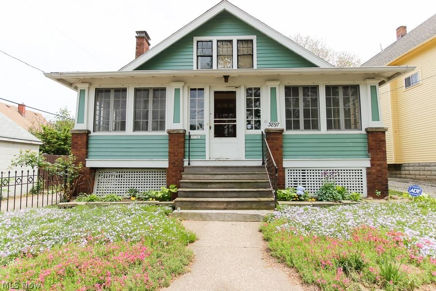 Darling Arts & Crafts style bungalow conveniently located in the Brooklyn Centre neighborhood only minutes from I-176, I-71, Metro Hospital, Cleveland Zoo, trendy restaurants and entertainment areas.  Welcoming cottage inspired front porch greets you as enter through the front door into the formal dining room with wood burning fireplace and built-in shelving.  Beautiful French doors lead into the office or den.  Large formal dining room offers additional built-ins.  All original woodwork, molding and hardwood flooring have been preserved! Updated kitchen (2013) includes unique wood ceiling, ceramic tile flooring, custom center-island, updated appliances which will remain with the home and a functional layout for today’s cook. The full bath has been updated (2014) with new shower liner, jetted tub, pedestal sink and lighting. Great second floor master bedroom with adjoining bedroom could be converted into a walk-in closet/dressing room, nursery or office. Full basement includes laundry