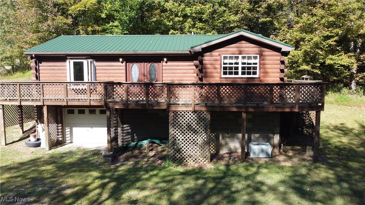 Well-maintained, one-owner 2 Bedroom raised ranch situated on a private 4.22-acre lot with a wooded backdrop, just minutes from local amenities. This inviting home offers a wraparound deck, a double-door entry into the living room, an equipped eat-in kitchen, a spacious primary bedroom with double closets and a laundry chute, a generously sized full bath, and a full basement with an integral garage. Recent updates include a newer metal roof, furnace, and fresh paint throughout. Conveniently located near the PA/OH borders, State Park, and Casino/Racetrack, it’s the ideal weekend retreat or full-time residence. Relax on the deck and enjoy the beauty of nature right in your backyard. The chimney is ready for easy wood stove installation in the basement for supplemental heat, if desired.