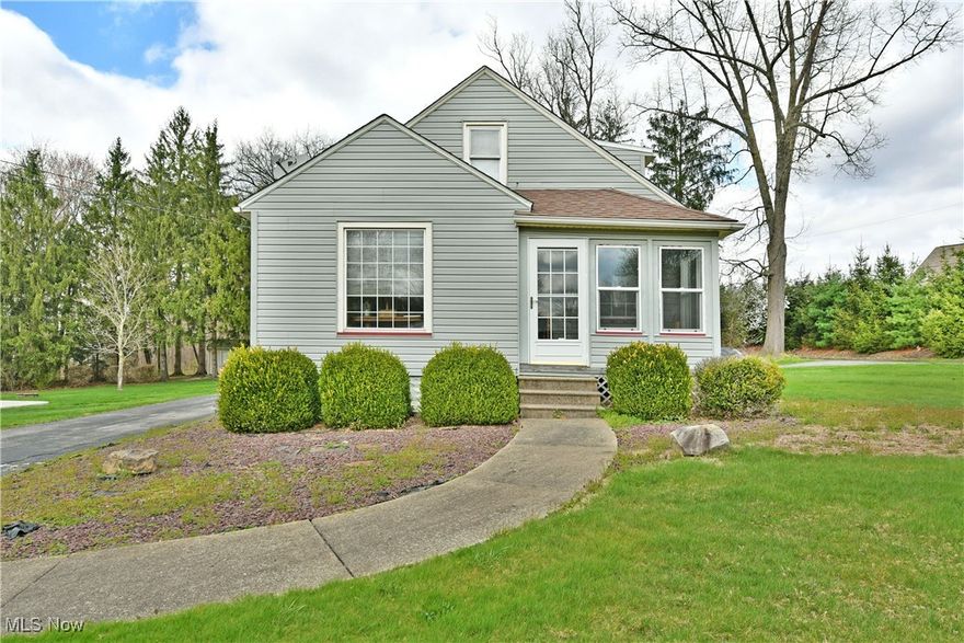 A hidden Howland treasure, this wonderful two-story home sits on an impressively sized lot at the end of a dead-end street, ensuring privacy and tranquility alike! Boasting plenty of curb appeal, you’ll immediately notice the stone landscaping and manicured shrubbery that marks the main entrance and covered front porch area, doubling as a sunroom. A wraparound driveway handles traffic flow with ease as a detached two car garage includes additional carport storage for a total of four spaces. Meanwhile, a large storage shed sits along the tree line with its bold, red roof. Step through the sunroom entry to find a remarkable carpeted living room, enjoying plenty of natural light from the tall surrounding windows. Adjacently, a formal dining room shares design cues as sculpted archways lead into the fantastic galley kitchen. Here, handsome tiled flooring joins the bright white cabinets and appliances while long running countertops handle daily tasks. Completing the first floor, an inviting bath and bedroom offer plenty of excitement. Upstairs, the larger loft bedroom makes for an easy master with its oversized footprint, bonus room and built-in storage. Additionally, the partially finished basement offers a lower family room, laundry services and provisions for a half bath with shower.