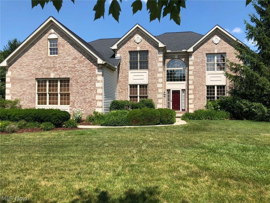 Beautifully appointed, brick front Colonial w/ over 5,500 sq.ft of total living space nestled in Westwood Farms with private views of the wooded Preserve. The exterior boasts attractive curb appeal w/ lush landscaping, 3 car side load garage & dramatic keystone & quoin details. Guests are welcomed by the inviting 2 story foyer. Double doors open to the private study w/ built-in bookshelf. Across the way are the adjoined formal living room and dining room. The lovely eat-in kitchen supplies granite countertops, stainless steel appliances, center island and arched entries into the vaulted great room w/ gas fireplace, skylights & 2nd staircase w/ catwalk. The laundry room & powder room round off the main level. The dual staircases lead you to the master suite w/ hardwood floors, sitting room, walk-in closet & en-suite bath w/ double sink vanity, corner tub & walk-in shower; 3 more sizable guest bedrooms & full bath w/ double sink vanity. Fantastic finished lower level w/ a sprawling recre