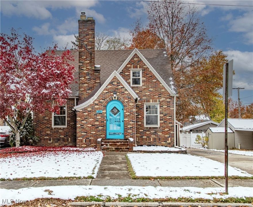 Welcome Home to This Charming Wadsworth Tudor! Step into this beautiful Tudor-style home featuring 3 bedrooms, 2 full baths, and gleaming hardwood floors that shine like a ballroom dance floor. Perfectly located near schools, parks, the community center, library, major highways, and the vibrant dining, shopping, and entertainment of Main Street Wadsworth, this home offers the ideal blend of classic character and modern comfort. An eye-catching blue front door opens to a welcoming foyer with built-in storage for coats and everyday essentials. The spacious living room features a gas fireplace, abundant natural light, and an open flow to the dining area, creating an inviting space for both relaxing and entertaining. The modern and bright kitchen impresses with white wood cabinetry, stainless steel appliances, tile flooring, modern fixtures, and stunning granite countertops - a space that is as functional as it is beautiful.  Need first-floor living? You will find it here with a convenient main-level bedroom and full bath. Upstairs are two generous bedrooms with ample closet space and charming dormer storage.  The finished basement adds even more versatility, offering a family room, recreation or home office area, a second full bath, and a laundry area, plus extra storage area. Step outside to enjoy the oversized paver patio, one-car garage, play set and a storage shed perfect for lawn equipment and seasonal items. Recently professionally cleaned and painted, with new carpet on stairs and in the family room, this home is truly move-in ready. Don’t miss this storybook Tudor that perfectly blends timeless charm with thoughtful updates. Schedule your showing today and spend the holidays in your new home sweet home.
