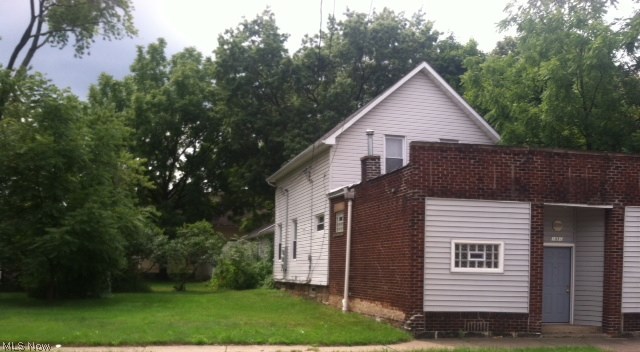 Rare find-two family home, storefront, 4 car garage and extra lot 40 expand. Updates include, C/A & newer furnaces both units, newer hot water tanks, windows, roof, siding, security system, waterproofed, electrical, pluming garage door openers, Appliance both units, washer dryer down, new carpeting and paint. Ready to rent. Possible 3 bds down Income potential $1700. & 1800 a month. 10 minutes to Downtown.