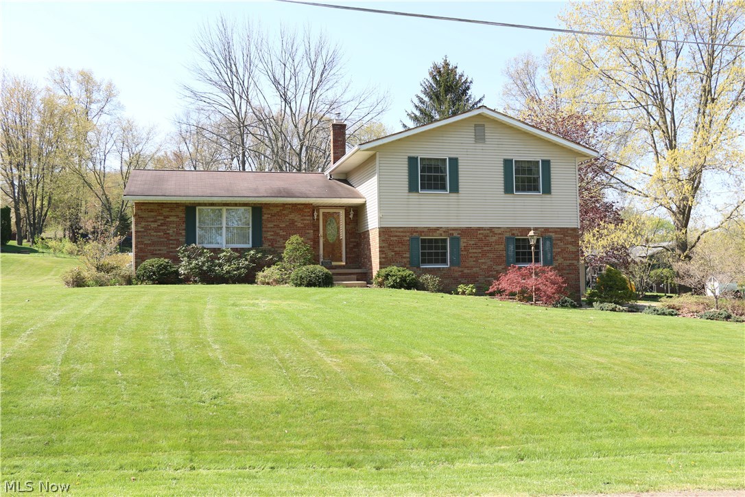 Welcome to your new Lake Township home! This pristinely maintained split level, offers all you could need. On the sun bathed main level you will find a very large living room, formal dining room and huge kitchen. The wonderful, recent kitchen updates include spanning acrylic countertops, top of the line Kraftmaid cabinetry, under mount sink and tile backsplash. Dishwasher, gas range and refrigerator all included. Just below the kitchen, and great for entertaining, is the family room. There is a large closet a half bath and glass doors out to the patio. On the second level you will find two very nice sized bedrooms with large closets, the main bath and master suite. The master bedroom has a walk in closet plus 2 additional closets. The master bath features a tiled, walk in shower, ceramic floors and a new vanity. The best part of the master is the private balcony (just redone). In the especially clean basement, there is a semi finished room, a large workshop/storage room, was