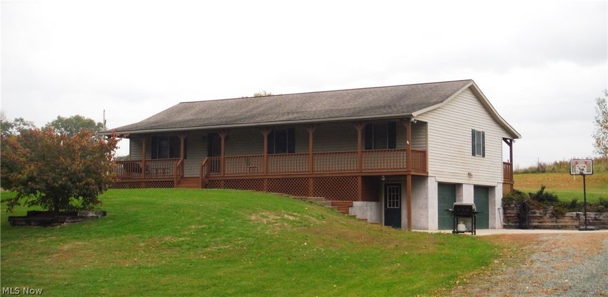 This Beautifully maintained Ranch home offers 3 Bedrooms, 3 Full Baths, Open Kitchen and Dining Area with Oak Kitchen cabinets and Wooden floors. Convenient Laundry room adjacent to the kitchen. Awesome covered Front and Back porches. 2 car attached garage with large concrete apron, makes a great place to play basketball. Also,  there is an additional 1 car detached garage. All This Nestled in a Great Country Setting.