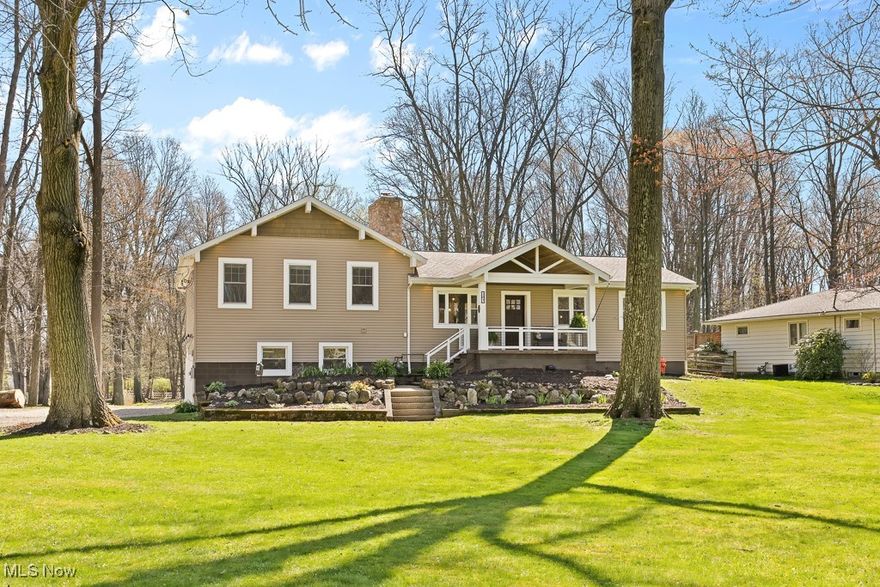 Experience the perfect blend of modern updates and serene country living in this beautifully renovated home situated on just under 2 acres in desirable Tallmadge. Boasting 4 spacious bedrooms and 3 full bathrooms, this property offers the ideal layout for comfort, function, and entertaining. A completely updated open-concept main floor featuring a seamless flow between the living room, dining area, and gourmet kitchen. The living room is anchored by a cozy wood-burning fireplace and surrounded by windows that flood the space with natural light. The kitchen is a chef’s dream, complete with Samsung smart appliances in stainless steel, a large center island overlooking the living area, hardwood flooring, tile backsplash, and sleek modern finishes. Off the living room, French doors open to a private office—perfect for remote work or a quiet study. The owner’s suite is a true retreat with double door entry, a peaceful sitting area, a generous walk-in closet, and a luxurious en suite bath showcasing a tiled stand-up shower, soaking tub, and double vanities. A second large bedroom features its own en suite and walk-in closet, while two additional well-sized bedrooms share an updated full bath. Convenience continues with a first-floor laundry room equipped with built-in storage. The full walkout basement offers endless possibilities with space for a recreation room, workout area, and ample storage. Outside enjoy the expansive outdoor living area, featuring a two-tiered deck with a pavilion complete with lighting and a ceiling fan. The lower deck offers two entries, including one leading to the covered hot tub—your own private spa escape. The property is complete with a raised garden, chicken coop, and tranquil pond—offering a perfect balance of modern living and outdoor enjoyment.
Don’t miss your chance to own this one-of-a-kind home in a beautiful setting. Schedule your private tour today!