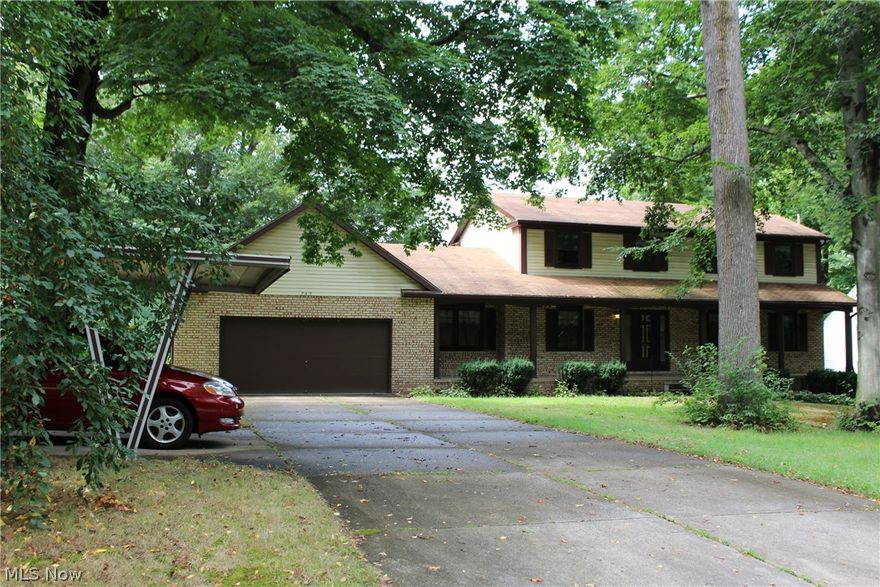 New and hot on market, this elegant colonial features 4 beds, 3.5 baths, 1 office, 1 fireplace, oversized 2 car garage plus 1 carport, finished walkout basement, porch, deck, pond view protected by fence!  Looking for more?  crown molding, chair rail, raised panel cabinets and pantry,  full wall brick raised hearth,  walk in closet ,make up vanity.  The garage has H/C water, drain, electric, opener, pull down attic access and utility door.  There are 2 bonus bedrooms and 1 full bath and 1 game room in the finished basement.  The separating walls can be easily took down to make the whole basement an open giant one if desired.  Newer flooring, carpeting, interior painting and the water heater is only 1 year old.    Hurry up, get this one before someone else does!
