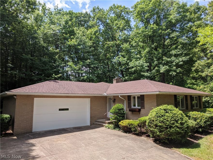 Custom designed brick ranch on 1+ acre secluded wooded lot.  This beautiful scenic location in popular Independence Ohio is minutes away from the best Cleveland has to offer in entertainment and shopping.  The quality home has over 1700 square feet of living area, highly efficient insulation in 6” exterior walls with R 19 value vs normal R 13, 3 season glassed in patio with outstanding wooded valley view,  new furnace and air conditioner,  new carpet in the living room, dining room, hallway, master bedroom, second bedroom and patio, completely repainted interior ceilings, walls and trim, fresh paint on all exterior doors and garage door, refreshed landscaping beds, new lighting in both bathrooms, 2.5 car garage with oversized ceiling height, finished basement section with custom bar and cabinets, kitchen dishwasher < 1 year old,  kitchen disposal < 2 years old, roof < 7 years old