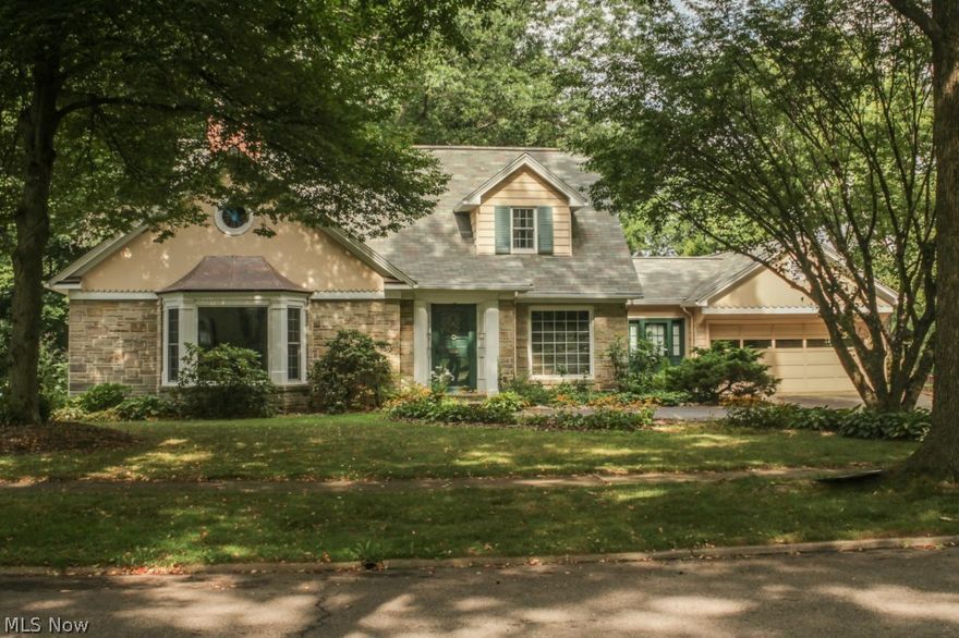 Beautiful & spacious 3/4 bedroom- 2 1/2 bath home in a desirable West Akron neighborhood.  This  2300+ s/f  Cape is loaded with charm and character & features gorgeous oak flooring and crown molding throughout, slate foyer entrance, 2 fireplaces and a lovely 1st floor Master Suite with stand-up shower and separate jetted soaking tub, double sinks and built-ins.  The open kitchen with Maple cabinets and solid surface countertops leads to an inviting sunroom addition and concrete patio overlooking a private, fenced backyard.....perfect for entertaining and backyard bar-b-ques.  Large living room with fireplace and lots of bright, natural lighting.  Upstairs you'll find generous sized bedrooms, a full bath and cedar closet.  The formal dining room and library/den with fireplace & built-ins, complete this charming, well-maintained home.  Great open, flowing floorplan.  This is a home that you will want to come home to!  Call today for a private showing!  Updates include :  Roof (2006-07);