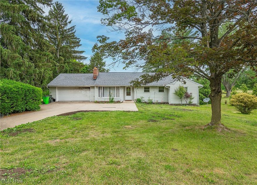 Welcome to 1383 Northeast Avenue! Sitting on nearly a full acre, this ranch boasts 3 bedrooms, 2.5 bathrooms, and serene country views! You will be greeted by your living room with a fireplace and continue into the dining room. Sliding glass doors give entrance to the back deck where you can enjoy your morning coffee. 3 great sized bedrooms are conveniently located on the main level. The owner's suite offers a spacious bathroom with a large soaking tub and the remaining full bath sits just down the hall. Venture downstairs to find a half finished walk-out lower level that can be used as a family room and an additional bedroom with stairs to the garage. Also featured is a half bath and loads of storage space. New roof 2020. 1 yr home warranty included for your peace of mind. This great home awaits your finishing touches! Schedule your private viewing today!