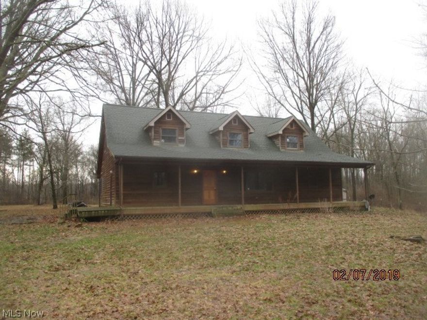 ....over the river and through the woods to anything but Grandma's house!  Nestled amongst the trees this cedar cabin style Cape home with elongated front covered porch makes for a perfect retreat from the busy world! Solitude, nature and comfort all in one. First floor master bedroom with private deck with master bathroom.   Full height vaulted ceilings with windows in the living room, WBSTV on stone hearth is a perfect setting for the gleaming hardwood floors. Light, bright and airy floor plan.  Loft style second floor with separate enclosed dual bedrooms - wonderfully sized with plenty of closet space.  The kitchen allows for easy access to plenty of cabinet and countertop space.  Dining area opens up to the main living area, a nice feature for entertaining.  Read all your favorite books in the study or use as a zen room!  Excessive storage space in the basement gives you lots to think about for finishing potential.... with a full bathroom partially started! The 6 car detached garage, workshop/outbldg, barn/stalls are here too, perfect for the artist, craftsman or animal lover....oh, did I mention it's also on 5.5 acres?  Previously on well water, converted to public water some time ago.