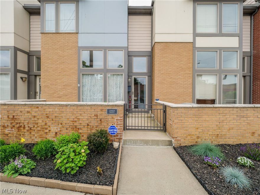 Extensively updated care free living in Lakewood Townhome! Sleek contemporary design both inside + out! Premium Bamboo hardwood flooring, Massive great room with ceilings! Granite kitchen with upgraded 42' cabinets, built in wine rack, under mount lighting, tons of cabinet space + Newer stainless appliances! Beautifully updated Bathrooms with stone and tile shower and granite tops, new vanity and much more! New carpet and paint throughout. Sliding doors lead to a totally private, enclosed outdoor courtyard/atrium like no other great. HUGE master bedroom suite. Private master bath with dual sinks, ceramic flooring, shower stall w/ glass doors! There's a 2nd bedroom with its own bath on this level PLUS a spacious home office / flex space / media lounge, too! Bedroom level laundry! Oversized 2 car garage! Great storage! A few minute walk to downtown Lakewood, seconds to the shore way, minutes to downtown, I-90 + Edgewater park! All the fabulous living in a city townhome PLUS Lakewood park