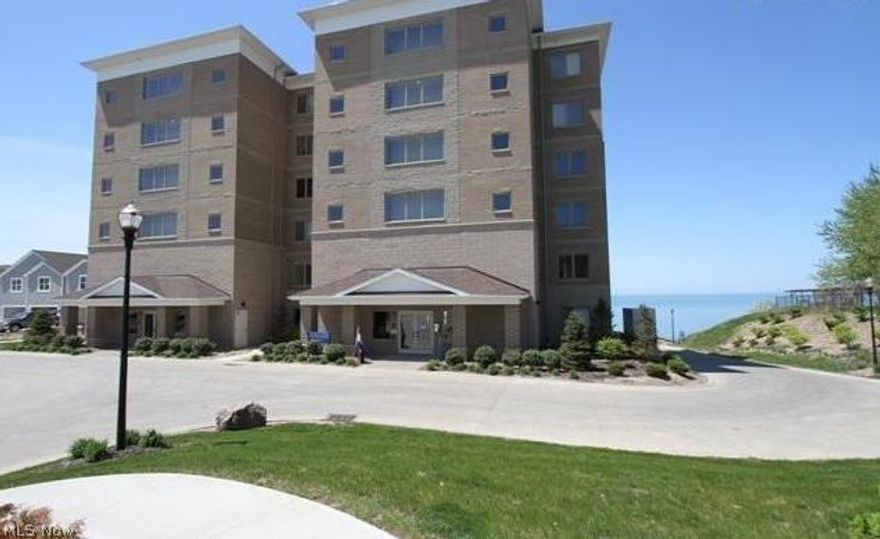You will not find anything like this along Lake Erie. Welcome to this spectacular first floor unit offering direct Lake Erie front views! Relax on the large 30' X 20' Patio that has a gas hookup for an outdoor grill and offers breathtaking views of the Lake. Wow, What More Could You Ask For? Enter into the Great Room that showcases a wall of windows, a fireplace and gleaming hardwood floors that flow into the Kitchen and Dining Area. The Kitchen offers beautiful white cabinets with dark luxurious granite countertops, pantry, high end stainless appliances, along with countless upgrades throughout. Escape to the Master Suite that bursts with loads of natural sunlight and features a private Master Bathroom with his and her sinks, a soaking tub and a seamless glass shower. You will find an additional Bedroom and Full Bathroom in the unit along with a Den/Bedroom 3, Large Laundry/Utility Room with plenty of cabinetry. The unit comes with 2 parking spaces in a heated parking garage, plenty o