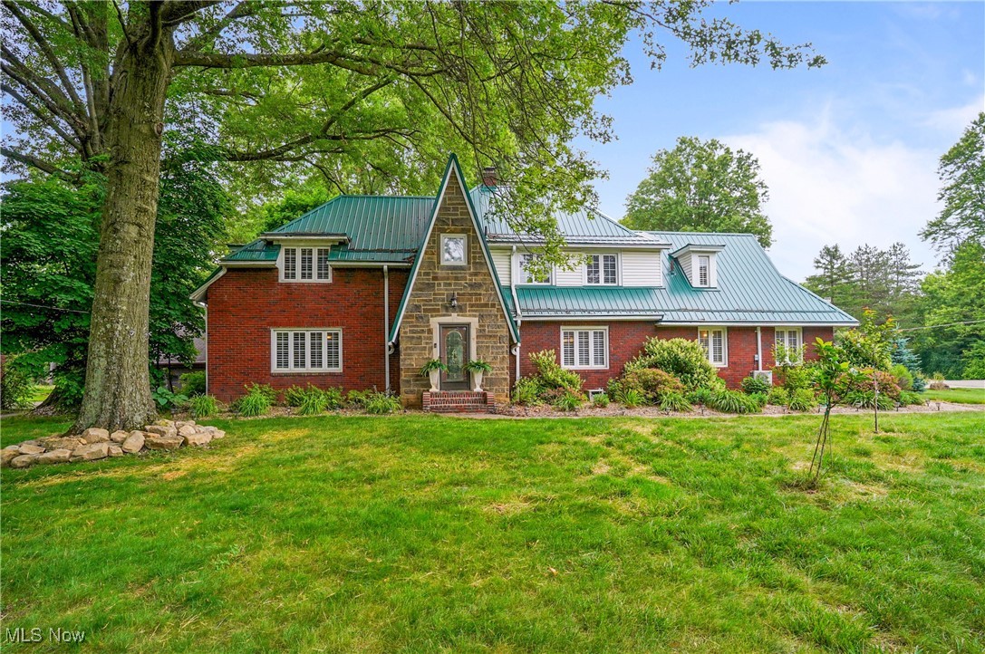 Absolutely fabulous and truly one-of-a-kind! This stunning property is nestled on 0.8 acres of lushly landscaped grounds, featuring vibrant gardens, gazebo, and a charming courtyard that creates a serene, private oasis.
The addition of a 34' x 24' steel barn spans three levels and offers a heated three-car garage, fully equipped with electric, gas, and water —ideal for vehicle storage, a workshop, or hobby space. Above is an unfinished loft apartment with a unique opportunity for customization into a guest suite, rental unit, or personal retreat.
Numerous notable upgrades shine throughout this exceptional home. The inviting formal living room with a gas fireplace and the elegant dining room both feature crown molding and gleaming hardwood floors, setting the stage for entertaining.
The gourmet kitchen impresses with stainless steel appliances, including convection oven, tongue-and-groove laminate flooring, extensive cabinetry, garden window, and cozy eating area. An outstanding highlight is the addition of a four-seasons room with gas fireplace and walls of sliders, capturing the essence of outdoor living year-round.
The first floor master offers a glamour bath w/soaking tub, heated floors, and dressing area w/French doors as separate entrance. A guest bath completes the first floor.
Two staircases lead to second floor and host four bedrooms all with hardwood floors, one ensuite and currently used as laundry room, a newer main bath with walls of tile, and sizable loft/sitting area. The lower level features exercise rm, rec rm, and 2nd laundry area. City water hookup available. Add'l amenities include 20KW generator, 2 new HVAC and 2 split units, 4 new electrical panels, new gas & sewer line, new fencing, custom plantation shutters in house and barn, & much more. Exceptional!! Extensive list in supplements.