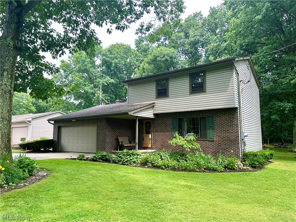 This charming two-story home offers a tranquil setting perfect for those seeking a peaceful retreat. Situated on a spacious half-acre lot, the property boasts stunning views of the surrounding woods, providing a serene backdrop for everyday living. Located on a dead-end street, residents can enjoy the privacy and quietness that comes with plenty of space between neighbors, making it an ideal escape from the hustle and bustle of city life. The main level of this home includes a spacious living room, family room with fireplace, and an updated eat-in kitchen perfect for enjoying meals with loved ones. The master bedroom offers an ensuite bath with walk-in shower, plus two additional bedrooms and a guest bath. Out back, the enclosed patio offers a peaceful spot to relax, unwind or have a bite to eat, while the deck provides a great outdoor space for entertaining or simply enjoying the view. With its generous layout, convenient amenities and beautiful views, this property is ideal for those looking for a peaceful and serene living environment.