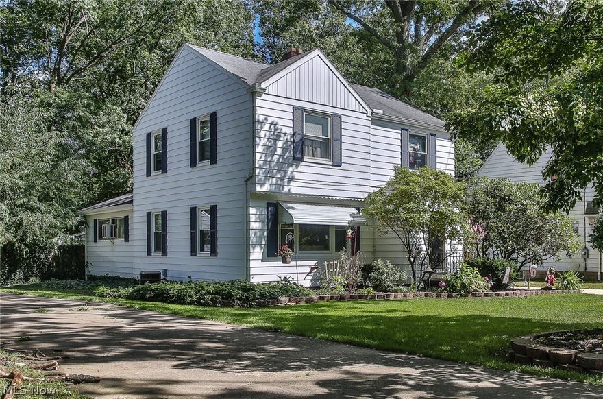 Pretty 3 bedroom 2.5 bath Colonial within walking distance of schools! Gracious living room with hardwood floors, wood burning fireplace and large windows with natural light. Formal dining area opens to a spacious kitchen with lots of cabinets and counter space plus charming breakfast nook. The first floor family room has rich paneled walls and a picture window overlooking the deck and the private wooded lot. Three bedrooms and a newly renovated bathroom upstairs. Lower level includes a big rec room with built in bar, second full bathroom and plenty of storage. Large deck, 2 car garage and so much more. Must see!