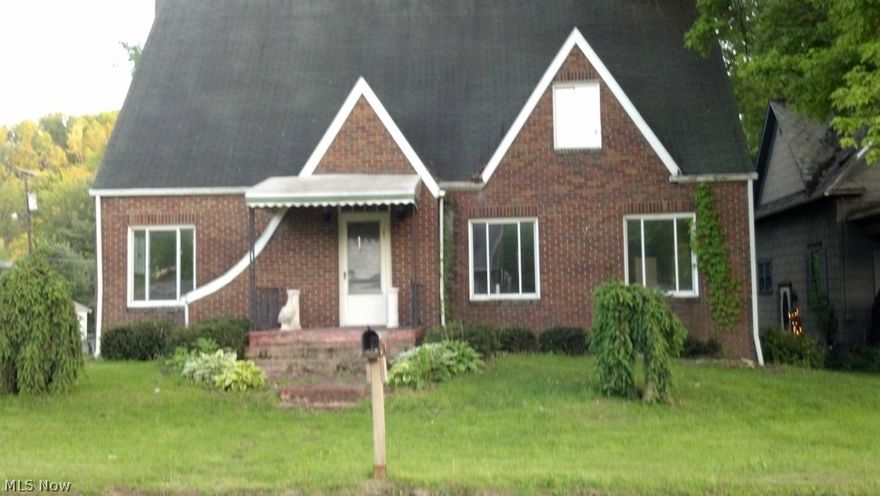 3 Bedroom home, 2 stories with 1 and a half baths. This home needs work: Needs new kitchen and both bathes. Upstairs bath leaked into kitchen so repairs required. This was a great home and could be restored to an absolutely gorgeous home....TONS of Space and Storage! Large yard over half acre! Great architectural details inside and out with a ton of hardwood floors and a huge basement with an overhead garage door to rear yard! Make no mistake, the home needs work so priced accordingly but is a great home in an awesome location! This IS a short sale so 3rd party lender approval is required; owner is in nursing home and just wants the home to be taken care of by new owners. Bank has already been contacted.
