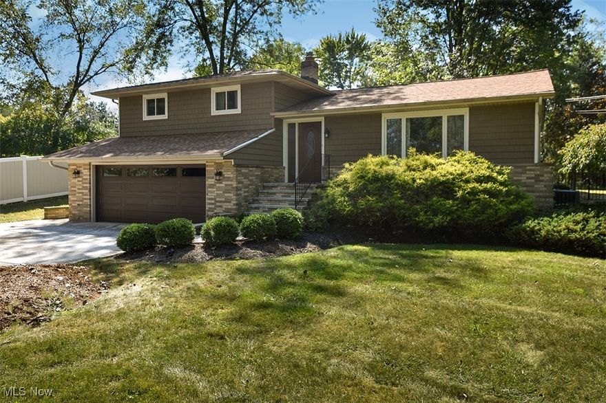 Welcome to this beautifully maintained split-level residence, nestled on a fully fenced half-acre lot offering privacy and wooded views. A newer front door opens into a welcoming foyer and a spacious, light-filled living room with updated carpeting. The formal dining room provides an elegant setting for gatherings and entertaining.  The eat-in kitchen has been thoughtfully updated with granite countertops, stainless steel appliances (all included), and a newer sliding door that leads to an expansive deck—perfect for enjoying peaceful outdoor moments.  Downstairs, the cozy family room flows into a remodeled half bath and a convenient laundry room, with washer and dryer included. Upstairs, you'll find three generously sized bedrooms with ample closet space and a fully updated bathroom featuring a dual vanity.  The partially finished lower level includes glass block windows and additional storage, offering flexible space for hobbies or relaxation.
Recent Updates Include:
- 2020: New shed with concrete pad, new siding, full and half bath remodels
- 2018: New A/C and hot water tank
- 2017: New roof with tear-off
- 2015: Fencing installation
With all major updates complete, this home is truly move-in ready. Schedule your private showing today and experience the comfort and care this property offers