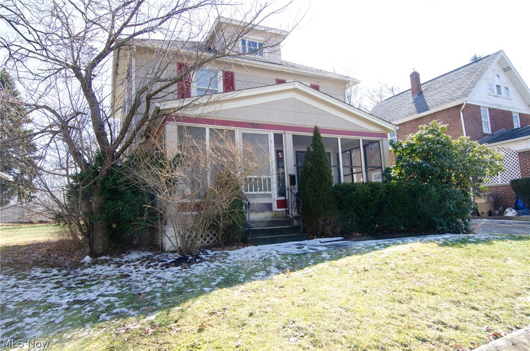 Traditional Cuyahoga Falls colonial at an unbeatable price! The unexpected bonuses are the private enclosed front porch, a park at the back yard and a two CAR GARAGE! This home still features it's original woodwork throughout the house as well as beautiful hardwood floors. Spacious living room, formal dining room with coat closet and recently updated kitchen. The gas stove, refrigerator and dishwasher will all stay. Fresh paint, updated lighting, new laminate floors and glass front cabinets make the kitchen crisp and bright. On the second level are three bedrooms, all with exposed hardwood floors. The bathroom has vinyl flooring, pedestal sink and a built-in linen closet. There is also a full walk up attic, perfect for easy access to all of your storage and a possibility to finish in the future. Garage has a new roof, newer door and opener. Walking distance from all of the shops, restaurants and breweries of Front Street and minutes from the Water Works Park, Brookledge Golf C