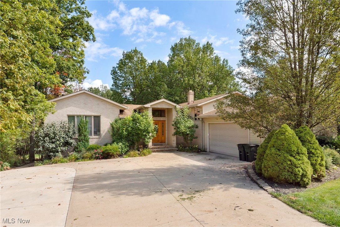 This is not a drive-by. The house is much larger inside than it appears from the outside. The seller is seeking a buyer who appreciates a beautiful lot with a fenced-in pool. Many updates and well-maintained. The 2-plus acres are tucked in the woods. The open floor plan is ideal for large families and entertaining. The driveway has been extended. The first floor features a very spacious open layout with a living room and dining room, complemented by an updated eat-in kitchen. The lower level includes a game room with a wet bar and a theater room. The second floor offers large bedrooms with two full baths. The master bathroom includes a fabulous walk-in dressing room. Invite your guests to join you for a swim or whirlpool in the large fenced backyard. Move-in ready, just in time to gather around the massive fireplace in the living room.