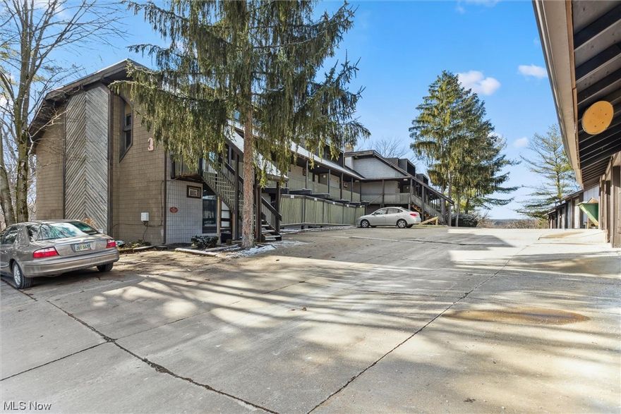 One of the BEST places to live in Akron - close to all major shopping, restaurants, Cuyahoga Valley National Parks and Akron University!  Enjoy easy living with this townhome! Step inside to find on the main level a very large living room sharing a smaller area for the dining room. Across the threshold, a comfortable half bath, cozy family room with a fireplace to keep warm on those winter nights, and a newly painted kitchen! Don't forget to go out on the balcony - perfect for those morning coffees or taking in the serenity of the environment. The lower level showcases two excellent sized bedrooms - one of which has sliders for easy access to the outside! Down the hall, if a beautiful full bath and laundry room. Have some comfort in knowing the roof of the townhome was replaced in 2022, roof of the garage replaced in 2023, all of the gutters cleaned out in Oct 2023, newer carpet - upstairs and master bed in 2022, and newer tile in kitchen and laundry in 2023. With a home warranty included, all you need to do in move in and enjoy!!!