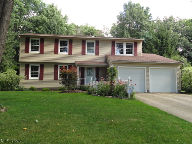 This pristine 4 bedroom 2.5 bath colonial in a desirable Stow neighborhood sits on a beautiful park like lot with brick patio, pergola and a large custom shed all overlooking a wooded area. Maintained with perfection and tastefully remodeled through out. Foyer entry to formal living and dining rooms. Crown molding compliments the entire first floor. The kitchen with new cabinets, appliances and quartz counters is redesigned with a built in window seat and island all open to the family room with skylight, fireplace, custom bookshelves and sliders to the patio. A half bath completes the first floor. Professionally finished lower level rec room or office with built in storage and gas fireplace. Updates include: roof, siding many windows, furnace, AC, insulation, water heater, all bathrooms, and a Nature Stone garage floor. Short distance to Rt. 8 and shopping. Fabulous home!