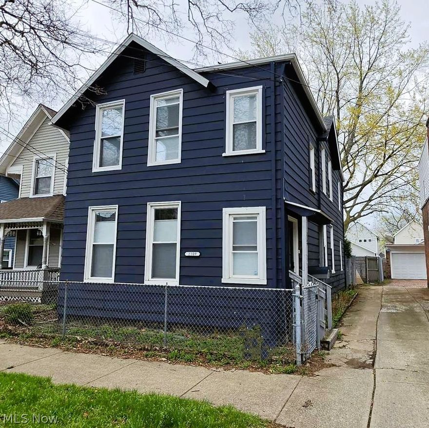 WOW!  Here is your opportunity to live in Ohio City!!  Beautifully updated colonial in the heart of the Ohio City neighborhood of Cleveland.  This is a converted duplex.  This spacious home has with 4 bedrooms, 3 bathrooms, tons of natural light and a neutral color scheme, there is even a space in the upstairs bonus livingroom with shelves, cabinets, counter and a mini-fridge - would be great for a coffee bar!  The backyard is large for this area and goes all the way back to the alley behind.  It is completely fenced in and offers a great space for relaxing or entertaining.  Don't miss out!