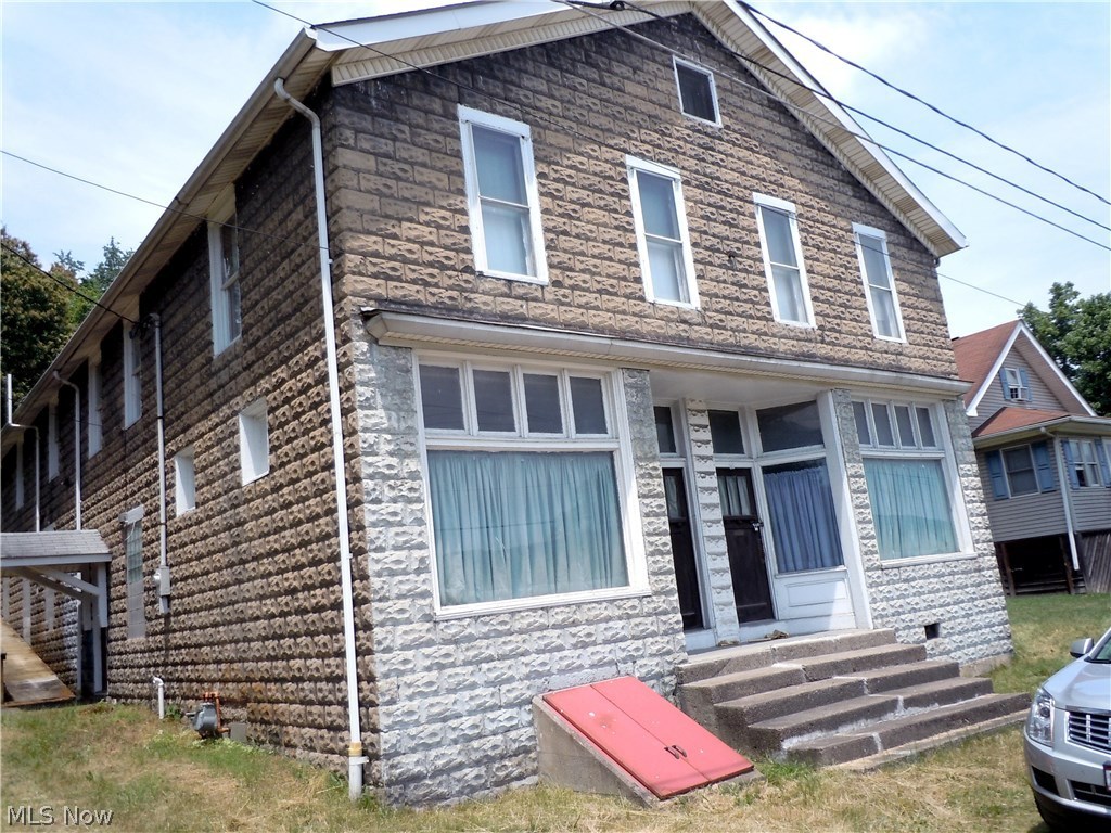 A Piece of Powhatan Point History! Commercial Building with a 4 Bedroom Apartment, Huge Meeting Room where years ago the UMW met, Two Store Fronts One was a Bowling Alley & One was a Bar both have original tin ceilings....7200 Sq.Ft. of Possibilities!!