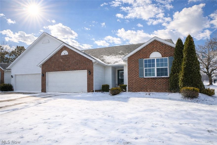 Beautifully updated condo situated on a desirable corner lot within a quiet circle, a 2-car garage and new flooring throughout the home. The dining and living rooms showcase vaulted ceilings and are anchored by a cozy brick gas fireplace, creating an inviting main living space. Two bedrooms are conveniently located near the front entry and share a full bathroom with a modern vanity and tub/shower combination. The private primary suite is tucked off the living room and offers a spacious retreat with a new granite countertop vanity, corner soaking tub, walk-in shower with seating, and a large walk-in closet. The kitchen has been refreshed with new countertops, a stylish backsplash, breakfast bar, and an eat-in area with a door leading to the back deck and expansive shared yard. Additional highlights include first-floor laundry and a finished lower-level rec room with carpeting, plus a large unfinished space with a bonus room— perfect for storage or future expansion. Come see this move in ready condo!