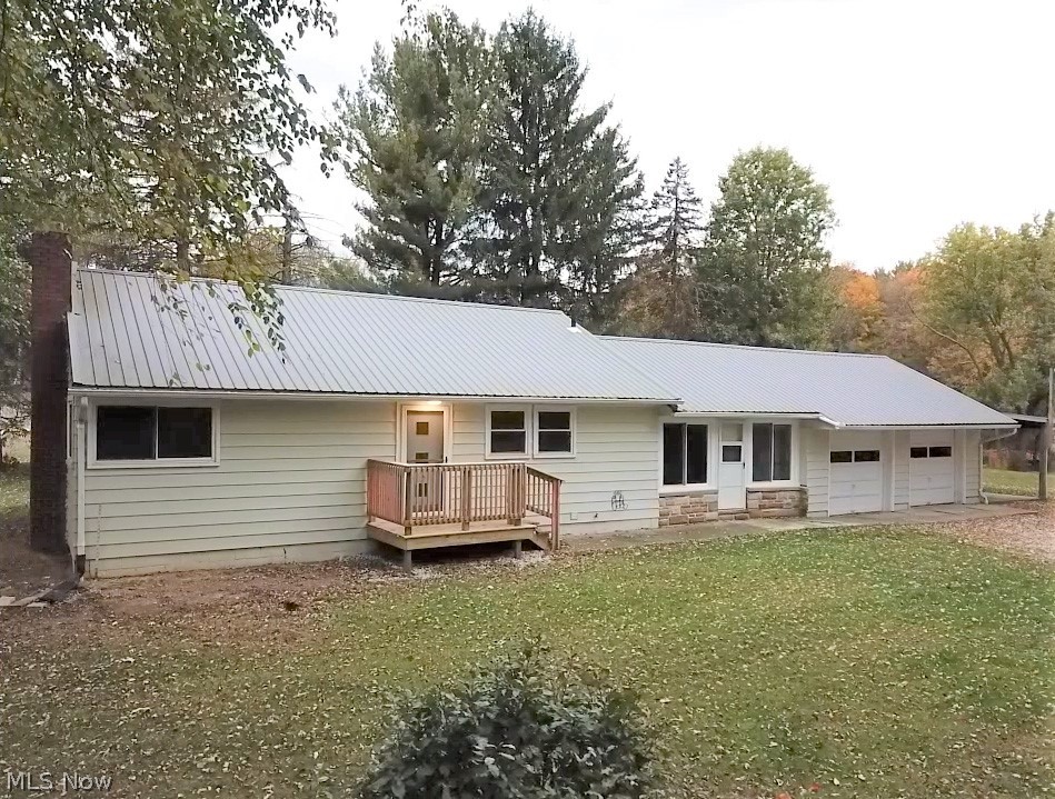 Welcome to 2533 E. Turkeyfoot Lake Rd! This property is perfect for the hunters and outdoor people! Almost 5 acres in Green your private oasis close to everything! The property features a 3 Bedroom & 1 Bathroom Ranch with a 2 car attached garage and extra carport on the side and around the back perfect for additional storage or cars! The house is recently updated with new windows (2016), new roof (2018), new painted white doors and trim (2019), freshly painted walls and new flooring throughout most of the house (2019). The basements is unfinished and a wide open slate glass block windows (2016) and new water softener (2016), currently a perfect space for storage! No worries as this home comes with 1 year warranty through America's Preferred HW! The property is perfect for riding ATVs and dirt bikes with trees and slopes! Schedule your showing today and come see how perfectly this beautiful serene setting will improve your quality of life and adventure!