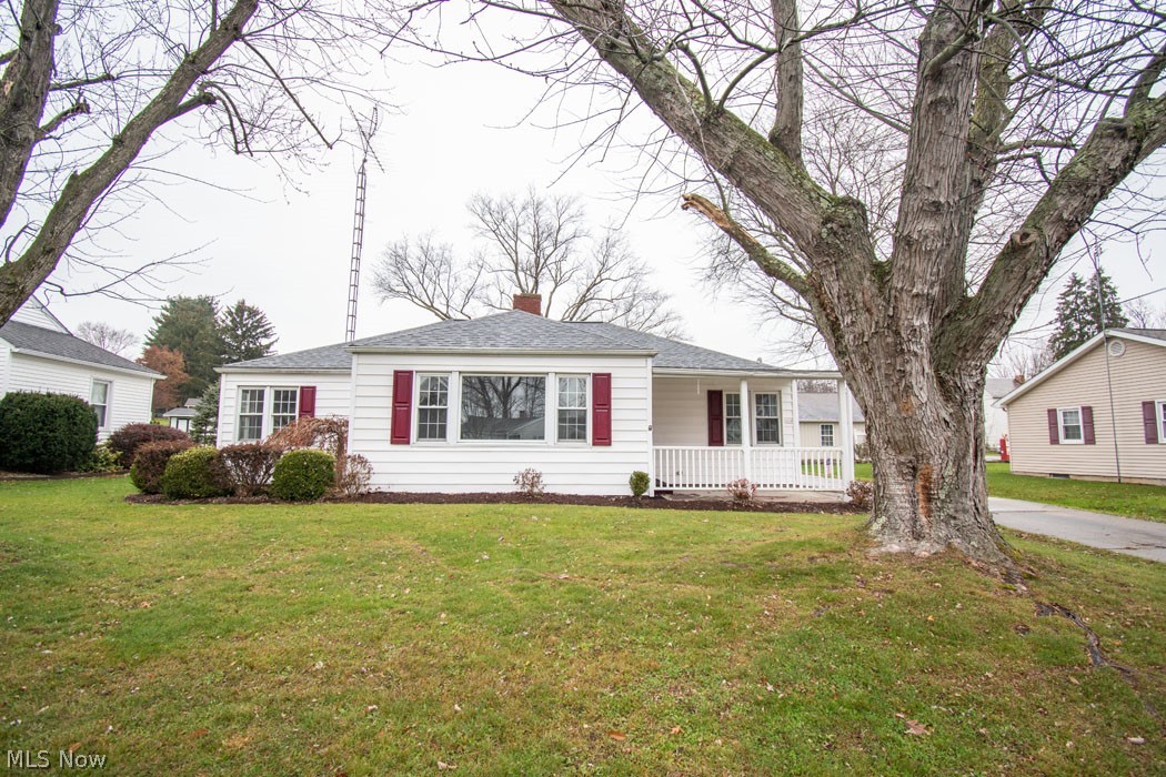 This charming ranch home offers three bedrooms and one bath at just over 1400 square feet. From the minute you pull in the drive you will notice outstanding curb appeal with updated landscaping and maintenance free vinyl siding. Enter from the quaint front porch into the light-filled and spacious family room with a decorative fireplace. Just off the family room is the dining room with a wall of windows making it great for entertaining. Three large bedrooms each contain their own closet and share the updated three-piece bath. Original hardwood flooring throughout the first floor. Just off of the kitchen you will find a covered patio great for grilling and relaxing. The large backyard is a perfect place for the kids to play and host family barbeques. An oversized one-car garage provides ample storage. The interior of the home has been recently painted and has a full basement that is plumbed for an additional bathroom and is ready to be finished. A new hot water tank and laundry connectio