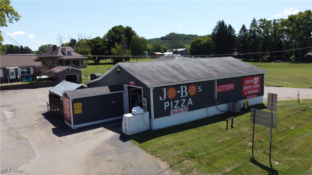 Stellar investment package opportunity!!! NEWLY remodeled bar, Drive-thru, Local eatery- with 2 BONUS, newly remodeled rental properties....together bringing in 2300.00 in monthly income.