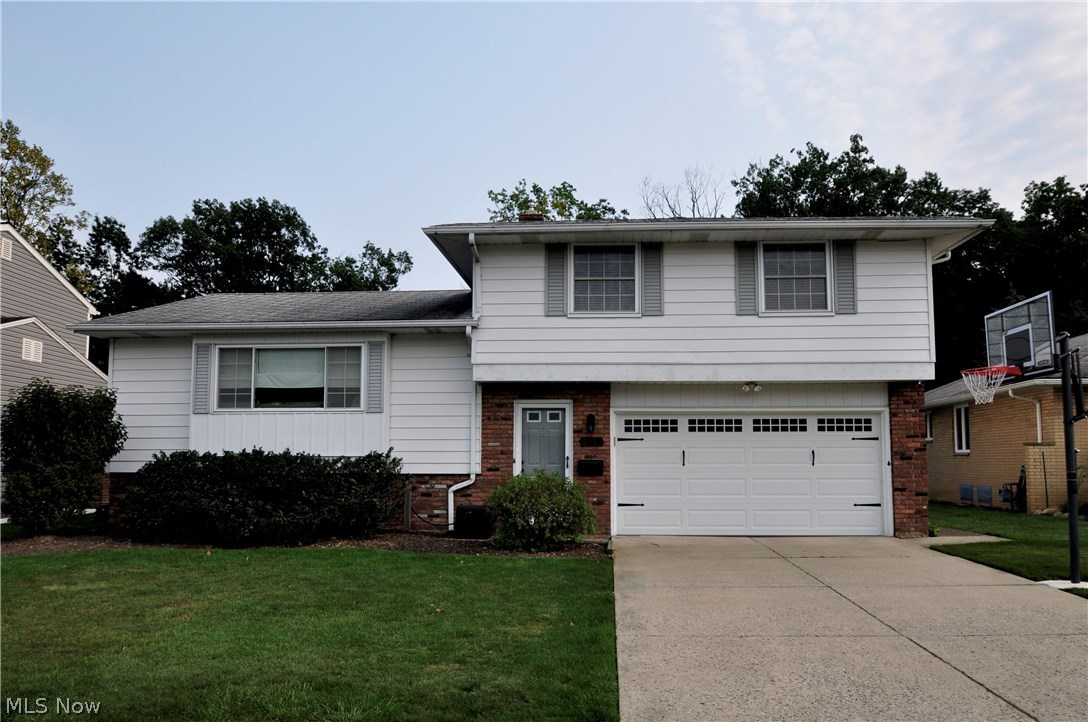 Welcome home to your move-in ready 3 bedroom 1 1/2 bath, split level on a quiet street in Parma. The house backs up to the metro parks, providing unbelievable views any nature lover will enjoy. The lower level was completely remodeled in 2016 to include new carpet, paint, 2 built-in storage units, glass block windows and a huge laundry room with extra storage. Other updates include: furnace and A/C replaced in 2010 with high efficiency models, full bath updated in 2013, 1/2 bath in 2012 and a new garage door and opener in 2015. All 3 bedrooms have original hardwood floors. Enjoy the metropark views from the large wood deck (recently re-stained) that leads down to a covered patio and the partially fenced in yard. The shed in the back provides extra storage. Call today for a private showing.