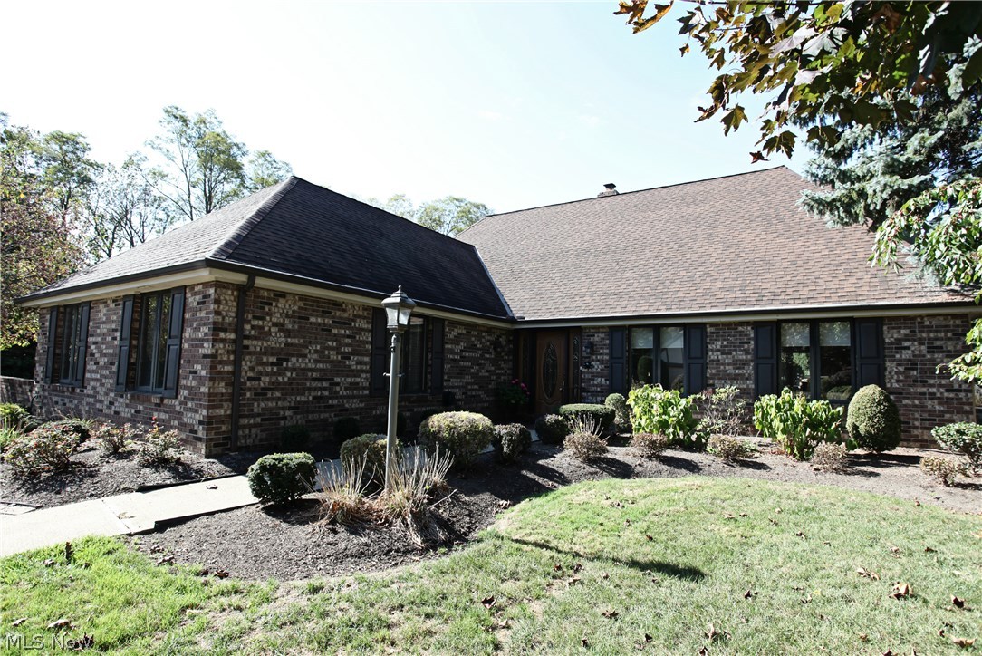 This very well appointed cluster home is one of the nicest in Gatehouse Village. The Kitchen, with granite and high-end stainless steel appliances (including a double oven and an induction cooktop!), opens to a vaulted Great Room, with a floor-to-ceiling fireplace, and a wall of windows overlooking the huge stone patio with 3 retractable awnings. It is the perfect home for quiet nights with your family or large gatherings of friends.. The luxurious Master Bedroom has a beautifully remodeled bath, a warm fireplace and sliding doors out to the patio. The Family Room also has a large closet and full bath, creating many more uses for this space. It can be used as a second Master Suite or In-Law Suite, if needed. The first floor laundry is also very convenient. The second floor has 2 bedrooms and a loft overlooking the Great Room. The home has a tremendous amount of storage. The over sized 2-car garage has a large work area, plenty of storage and it is heated. This home has all of