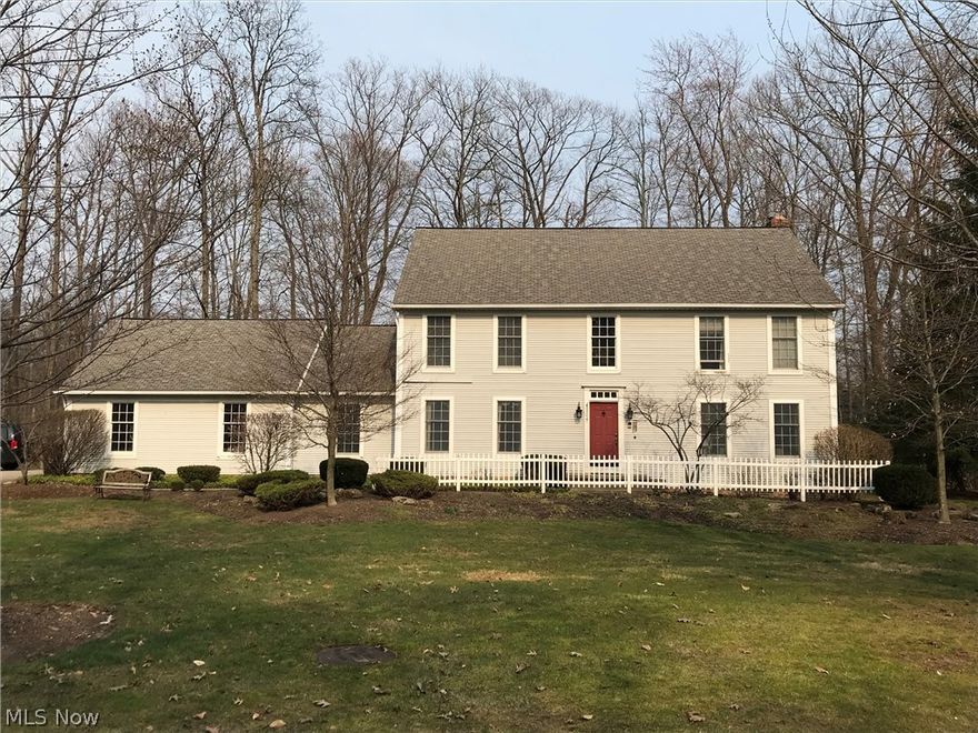 Charming classic colonial situated on wide wooded lot on private cul-de-sac. Good sized kitchen with updates, cherry cabinets, granite counter tops and island, eat-in area with opening to adjacent large family room which features gas log fireplace, plenty of room to relax and enjoy the beautiful view of the backyard. Dining room and living room open to front hall and adjacent rooms for nice flow when entertaining. Cozy screened in porch off the kitchen offers private and comfortable setting. First floor office, laundry and half bath off the back hall. Generous sized master bedroom with vaulted ceiling, his and hers closets, and master bathroom offers two sinks, whirlpool tub and stall tiled shower. Very large, open finished basement recreation room with area for pool/ping pong table, oversized seating and a full bathroom. Plenty of storage in unfinished space. Decorative white picket fence enhances the landscaping out front and a new aluminum fence creates a safe play area or enclosed