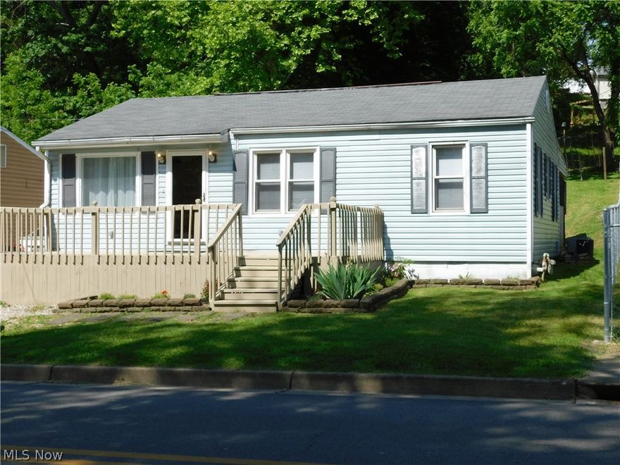 3 bedroom 1 bath home with large eat-in kitchen, screened in porch on back of home, large deck like porch in front.