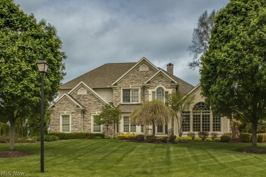 Golf Course Frontage , lovely stone and stucco design Colonial with  3 car garage.  This beautiful Home aligns itself with the many acres of manicured Golf Greens at Rosemont Country Club!    And YOU don't have to maintain the Greens!!!! An open floor plan, stately walls of windows, an updated kitchen/ granite counter tops, surround sound, wood floors, and easy access to the back deck overlooking the Greens!  Enjoy the spacious side yard for a good game of catch, badminton, a bit of shade or a summertime barbecue with Friends! This house has it all!  First Floor Master suite & bath with his and her walk in closets.! Three additional bedrooms, a Jack and Jill bath .... 5 bathrooms in all!  Built in book shelves in Library and Great Room; Entertainment wall includes a marble gas burning fireplace  The fully finished lower level  and recreational room is large enough for a pool table, full furnishings AND ready for your personal entertainment plans, future media center, and guests -with a