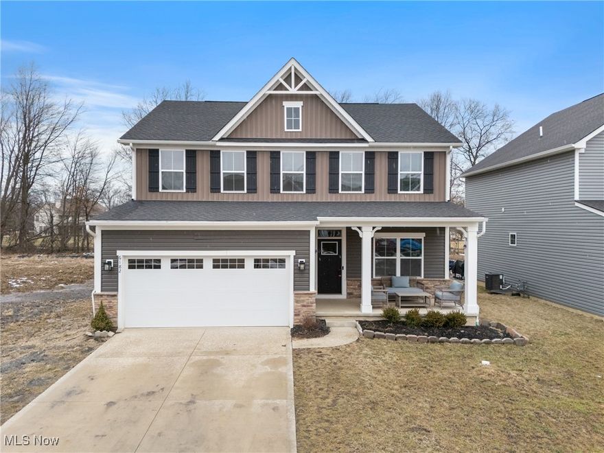 Why Wait? Move Right into This Stunning, Upgraded Columbia Colonial! Skip the hassle of new construction and the added costs of builder upgrades—this exceptional 2-year-old home has them all! Located in the highly sought-after Amherst School District, this home offers 4 bedrooms, 3 bathrooms, and a thoughtfully designed floor plan with high-end finishes throughout. (The 4th bedroom is currently used as a loft/den but can easily be converted back.) From the moment you arrive, you'll be captivated by the gorgeous two-tone vinyl siding, stone accents, and inviting covered porch. Step inside to a bright and open layout, perfect for modern living. A private first-floor office with French doors provides an ideal workspace, while the open-concept kitchen and family room make entertaining effortless. The gourmet kitchen is a chef’s dream, featuring, large center island with stylish pendant lighting, upgraded white cabinetry with under-cabinet lighting, beautiful tile backsplash and granite countertops, stainless steel appliances (including a refrigerator) spacious dining area.  The family room is equally impressive, highlighted by a stunning stone fireplace that adds warmth and character. The garage entry includes a mud area with ample storage closets, keeping everything organized. Upstairs each bedroom features ceiling fans, recessed lighting, and generous closets. The centrally located laundry room adds everyday convenience. The primary suite is a true retreat, complete with large walk-in closet with attic access, ensuite bath with dual sinks, and beautiful tile walk in shower.  The unfinished lower level is a blank slate, already plumped for a full bath and wet bar, giving you endless possibilities for customization. Prime Location! Just minutes from downtown Amherst, shopping, dining and major highways, this home offers the perfect blend of comfort and convenience. Don’t miss this incredible opportunity—schedule your private tour today!