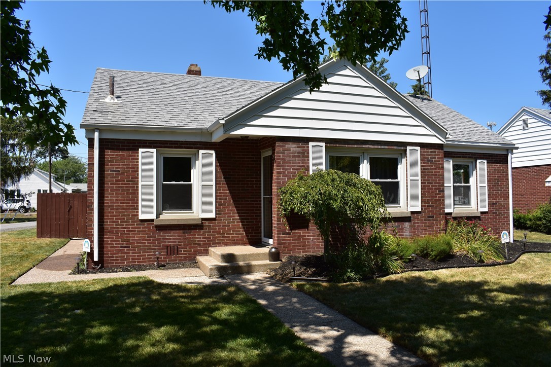 Charming ONE STORY BRICK home located close to Hancock Elementary School! This adorable home has beautiful hardwood floors, a spacious laundry/utility room, garage and a large kitchen with all appliances staying and an island. Freshly painted interior, furnace and central air unit replaced in May 2019, newer doors and carpeting, some bathroom and kitchen updates. Enjoy entertaining on the HUGE patio in the private backyard! Close to Cedar Point and marinas. All dates, room sizes and square footage are approximate.