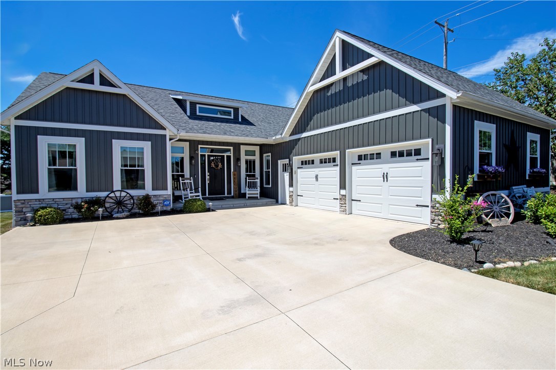 Beautiful Capstone Custom Homes' 2019 Parade Home! This 3 bedroom, 2 bath modern farmhouse has an inviting curb appeal . Inside, the floor plan is open and airy with functional flow between the kitchen, dining area and great room. The great room with floor-to-ceiling windows that allow an abundance of natural light in. In the kitchen is featured Cambria Quartz countertops with a large island for entertaining. This home also features a mudroom which includes a drop zone with lockers for additional storage and a barn door leading to the laundry area. The split-bedroom floor plan boasts a huge owner's suite with a walk-in tile shower, a freestanding tub, and an extra large walk-in closet. The remaining 2 bedrooms are generously sized. This home is ready to meet all of your outdoor entertaining needs with a beautiful partially covered deck and partially fenced-in backyard. Full basement with amble area to add more living space. This home is in brand new condition and move in ready. Don't miss this gem