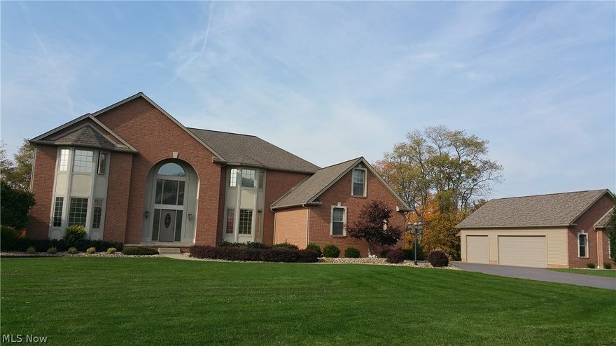 One of a kind custom built home with no expense spared.  Incredible views.  4 bedrooms 3 1/2 baths.  Finished basement (2012) with access from attached 3 car garage.  Kitchen has new Quartz counter tops (2013) Beautiful oak cabinets (custom cabinet for your kitchen aid stand mixer!) Wolf cooktop (vented to outside)..double ovens.  1st fl laundry.  6 panel doors thru out.  Custom leaded palladium windows in front. Invisible fence over whole yard (need unit) Prewired for cent vac & security.  Detached 3 car garage with walk up attic (2015)  New garage doors on main garage (2015) So much more!!!  First floor bedroom and full bath.  Lot's of recessed lighting!  Oversized master suite has glass french doors to a den/nursery...huge walk in closet with attic access that you can enlarge the closet even more!