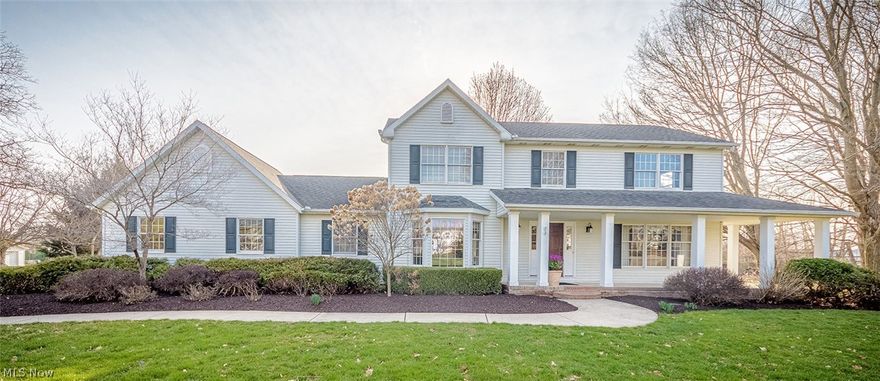 This property is uniquely located in Portage County with a Stow mailing address and in the Stow school system. It is a  spectacular 5 bedroom, 4 full bath Colonial  situated on 4 acres of flat open land including a 40 x 30 outbuilding suitable for six cars and/or an RV.  Benefit from Portage County property taxes plus horses are permitted & with township zoning there's potential to  operate a business from home. Stepping into the foyer entry you'll find 3400 sq ft of living space with a formal living room & formal dining,a cozy family room with fireplace, a beautiful eat in kitchen with gleaming hardwood floors, cherry cabinets, granite counters, new backsplash & stainless appliances. Continue on  to see the  amazing 28 x 17 Great room w/ cathedral beamed ceiling surrounded by windows welcoming the natural light.  Finishing out the first floor is the newly updated laundry room and a first floor bedroom or office with a full bath. Upstairs you'll find 4 generous sized bedrooms & three f