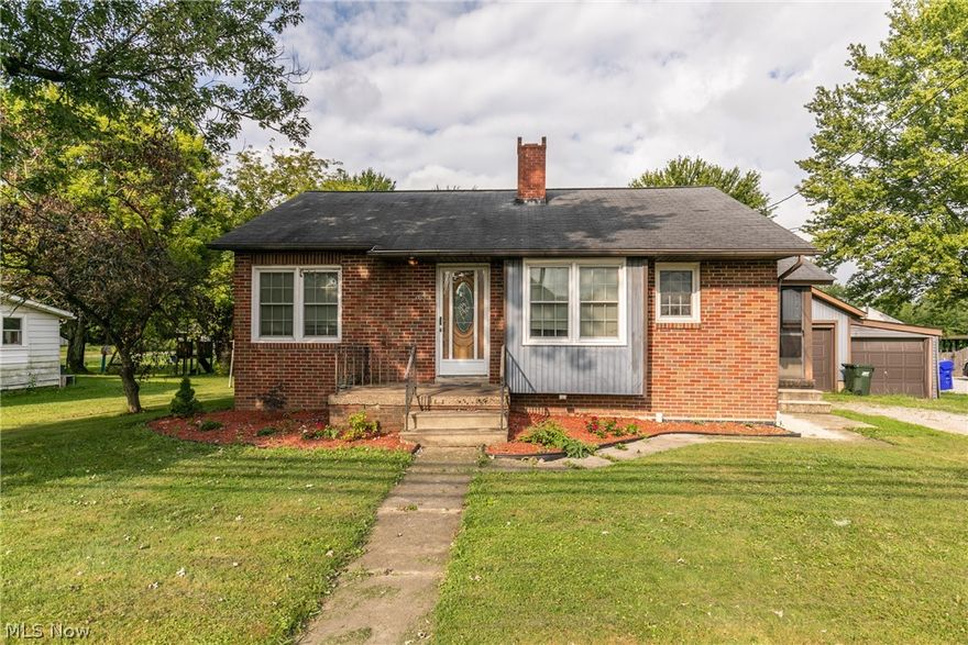 Welcome home to this charming move-in ready 3-bedroom, 3 full bath brick home in the Heart of Lagrange.  This home features a spacious kitchen with white cabinetry, an eat in kitchen and refinished hardwood flooring flowing into the living and dining area.  The large master bedroom with new carpeting and fresh paint offers a walk-in closet and newly remodeled master bath. The laundry is conveniently located off of the master bedroom with walk out access to the deck overlooking the large back yard. The second bedroom is on first floor with refinished hardwood floors and another full bathroom down the hall. The walk-up attic is fully finished and is perfect for a kids oversized bedroom.   The full basement is partially finished with a full bathroom and plenty more room for storage and recreational space. One car detached garage with added space for extra storage. Screened in side porch.