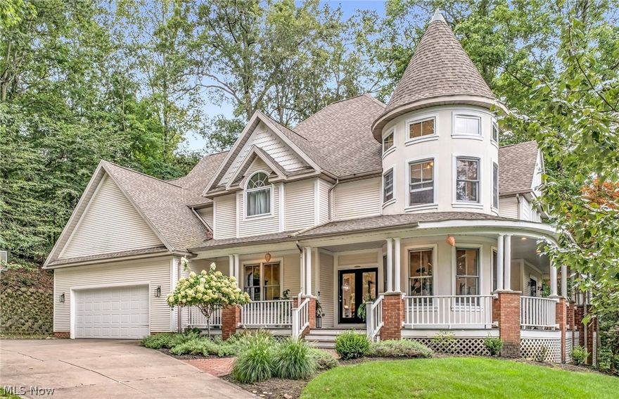 Welcome to 8851 Spring Valley Dr in Broadview Hts, a truly unique, vintage victorian meets modern farmhouse, 4-bed, 3.5-bath home filled with character & timeless charm. From the moment you arrive, the ample curb appeal & heated drive lead you to the inviting wrap-around porch, setting the tone for this special property. Inside, the 2-story foyer, rich woodwork, & large windows fill the home with warmth & natural light. The kitchen is a chef’s dream with quartz counters, custom island, stainless steel appliances, & plenty of built-in cabinetry, all complemented by a secondary dining space in addition to the formal dining room. Just off the kitchen, the family room features a striking fireplace, creating an inviting spot for gatherings & a study with built-in bookcases provides the perfect retreat for work or reading.  The thoughtful floor plan showcases 4 spacious bedrooms, 2 full bathrooms, & the laundry all on the 2nd floor. The master suite offers a true retreat with a vaulted ceiling turret sitting area & the en-suite is complete with twin sinks, a luxurious soaking tub, & a separate shower, creating a spa-like oasis that feels both elegant & inviting. The remaining 3 bedrooms are also very spacious & share a full bathroom with quartz counters & newer custom stone shower. The newly finished basement with LVP flooring adds to the living space with a family room, kitchen area with an eating island, full bathroom, & a bonus room that can be used as a play room, home gym, or extra study. The walk-up attic is a designer’s dream
boasting high ceilings & natural light just waiting for your finishing touch. Outdoors, enjoy seamless indoor-outdoor living with a newer back patio with private views of a serene creek, perfect for hosting & entertaining. With its architectural detail, spacious layout, & updates throughout, this home is an ideal blend of elegance & comfort in one of Broadview Heights’ most desirable neighborhoods with a top rated school district.