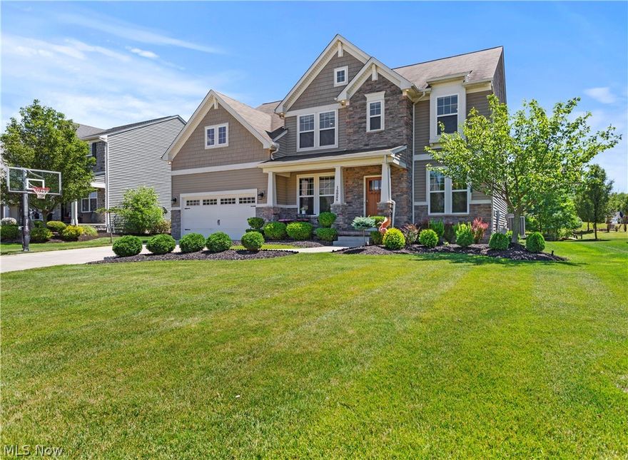 Impeccable home filled with exquisite design and high-end updates! From the moment you step foot onto the ceramic stone front porch, you will know this home will be special. The stunning granite faced fireplace in the vaulted great room beckons you into the heart of this home and opens to the informal dining area and gourmet kitchen with hardwood floors, granite countertops, center island and all the appliances including a wine fridge. Elegant formal living room and dining room with crown molding and a chair rail plus custom new light fixtures. Upgraded half bath with custom vanity and sink and a convenient first floor laundry. Gracious vaulted owner’s suite includes a large walk-in closet, in-suite spa-like bathroom with dual marble sinks, soaking tub and shower. Three additional nicely sized bedrooms, an office or study area, another full bath and a huge loft space perfect for a teen space, play room or more complete the second floor. The fully finished basement provides 1,000 additi