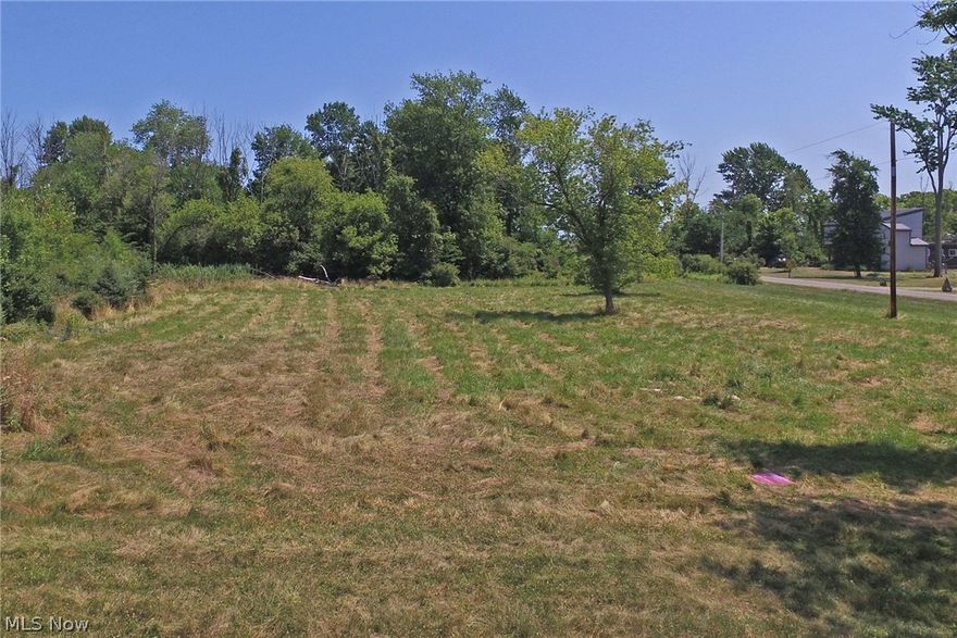 Spectacular 1 Acre Corner Lot With Lake Views and Private Beach Access! Beach Area Has Picnic Area With Tables and Grills. City Water Is Available At the Street! Water Tap Fee Has Been Paid! ($7,000 Value!). Septic Design and Approval Good For Five Years ($2700 Value).