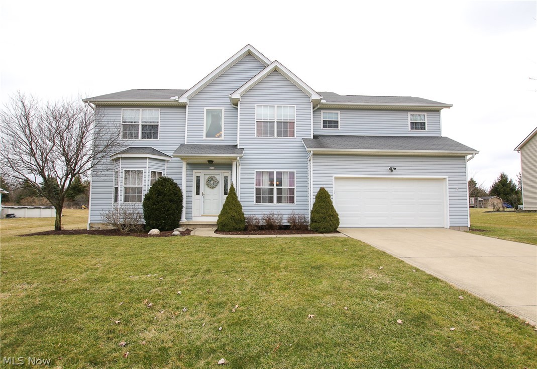 You won't want to miss this beautiful 4 bedroom, 2 full, 2 half bath located on a half acre lot in the Timber Hill Subdivision. Gather in the large family room with wood burning fireplace or relax in the living room. There is newer carpet in the family room, living room and the second floor. You will enjoy cooking in the large kitchen with ample counter space, large pantry and eat-in area. Real hardwood floors throughout the kitchen, dinette and hallways on the first floor. There is a 1st floor laundry room with front load washer and dryer with a large counter top, plenty of cabinets and a large closet. Upstairs you will find a spacious master bedroom with vaulted ceilings. The custom walk-in closet features over 25 ft of hanging space plus drawers and shelves for shoes. The master bathroom has a 4 ft shower, double sinks and 5 ft jetted tub. There are 3 additional large bedrooms located upstairs and another full bath. The finished basement has a home office with built-in de