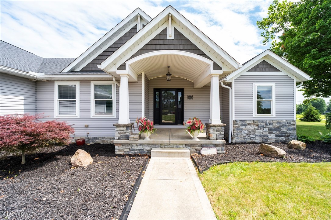 Homes like this don’t come around too often! Built in 2016, this beautifully designed home offers the perfect blend of functionality and comfort, set on just under 2 serene acres. Thoughtfully built with two spacious primary suites, each featuring double sinks and large walk-in closets, it's ideal for multigenerational living or guest accommodations. Two additional bedrooms share a Jack and Jill bath with double sinks, providing space and privacy for everyone.
The heart of the home is an open-concept kitchen and family room anchored by a cozy gas fireplace. A chef’s dream, the kitchen boasts a Bertazzoni gas range, abundant counters, pantry, and a large dining area that flows effortlessly to the outdoor patio. A four-season sunroom—with privacy doors—extends your living space and frames peaceful backyard views.
The oversized 2-car garage leads to a convenient mudroom/laundry area with a stylish barn door, just steps away from a half bath. Enter the basement through the garage or inside the house. Downstairs is another large living space with a full bath and a second kitchen featuring a nine-foot island, soft-close cabinetry, and deep sink—perfect for entertaining or accommodating extended stays.
Outside, a two-story workshop with electricity and a covered porch is ideal for hobbyists or yard equipment. Spend evenings relaxing on the Trex deck, patio, or around the fire pit, soaking in countryside sunsets.
Set in a rural landscape with wide-open views and tranquil surroundings, this home is ideal for those seeking peace—but with the convenience of shopping and dining options just minutes away.