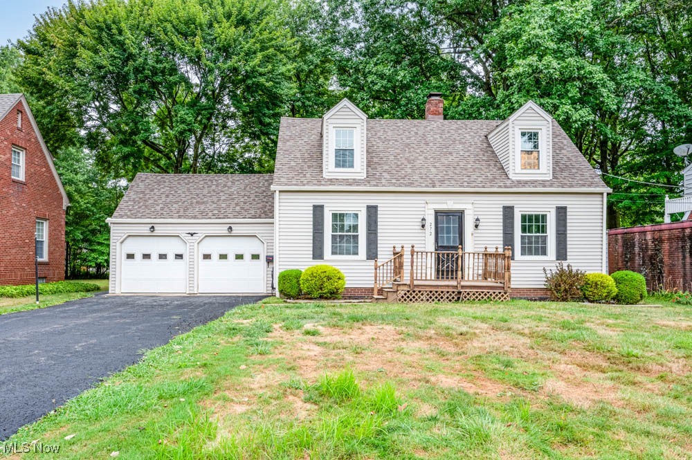 Welcome to 272 Ewing Road. This 1937 square foot 3-4 bedroom, 1/1/2 bath home is located in quiet Boardman neighborhood. Upon entering into the foyer you are greeted with newly refinished hardwood floors that continue into the large Living Room with gas fireplace and also into the Dining Room where you can enjoy entertaining. The Great Room has wood-like flooring and plenty of natural sunlight through the sliding glass windows, lots of cabinet space in the kitchen and a door leading to the private fenced backyard with patio and deck. Second floor features 3 large bedrooms and 1 smaller bedroom that may also be used for an office, studio or nursery. a full bath completes the 2nd floor. Basement has a walkout door to the spacious 2-car garage. Updates include newly refinished hardwood floors and new carpeting (August 2025), Roof (2017), and newer vinyl siding & newer Windows. Schedule a showing today!!