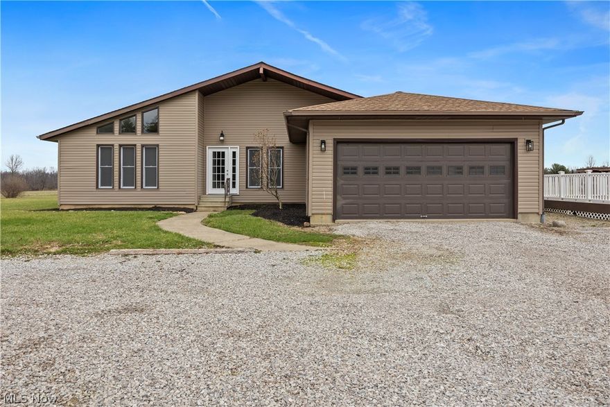 Discover the perfect blend of modern updates and peaceful country living with this beautifully refreshed ranch, set on over eight scenic acres. Offering more than 2,000 square feet of living space, this home delivers both style and comfort inside and out.
From the moment you arrive, the home’s inviting curb appeal stands out, featuring updated siding and windows (2026) with a subtle contemporary touch. Step inside to a bright, airy foyer that opens to a spacious living room with vaulted ceilings and a cheerful ambiance, while a formal dining room sits just opposite—ideal for entertaining.The fully remodeled kitchen (2026) is the heart of the home, thoughtfully designed with granite countertops, a large center island, two-tone cabinetry, and stainless steel appliances. It flows seamlessly into the expansive family room, where patio doors frame serene views of the surrounding countryside.
Throughout the home, you’ll find stylish luxury vinyl plank flooring throughout (no carpet!) and updated light fixtures that enhance the modern feel. The private owner’s suite is tucked toward the rear of the home and features a spa-inspired bathroom complete with a massive custom tile shower with glass surround, a soaking tub, and dual vanities.Additional highlights include convenient first-floor laundry, a large waterproofed basement, an updated electrical panel, and a Generac backup generator for added peace of mind.Outside, enjoy the wide-open space with two metal outbuildings for storage and a deck featuring composite decking and vinyl railings—perfect for relaxing or entertaining while taking in the natural beauty around you.

This is a rare opportunity to own a move-in-ready home on acreage with thoughtful updates throughout—don’t miss it!